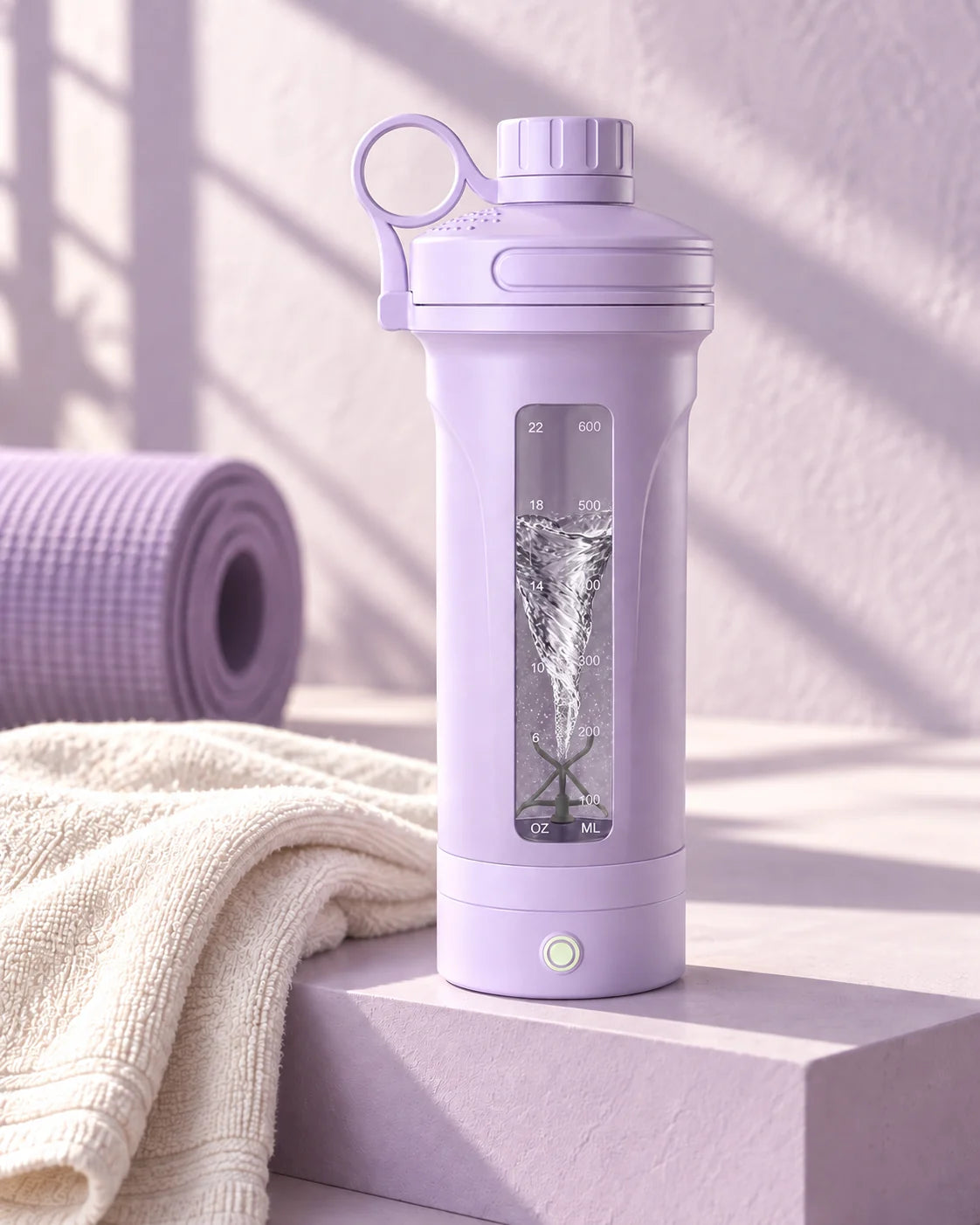 Lavender mixmate electric shaker bottle with a liquid vortex visible through its front window, beside a workout mat and towel